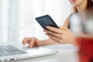 Female entrepreneur checking notifications